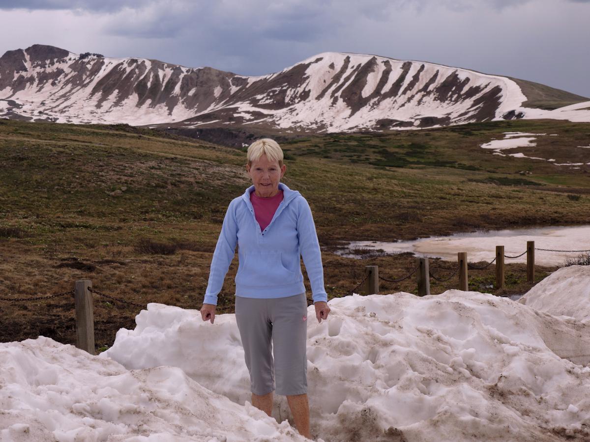 P1010462.jpg - Terri atop Independence Pass. At 12,000 feet, there pretty much is always snow here.