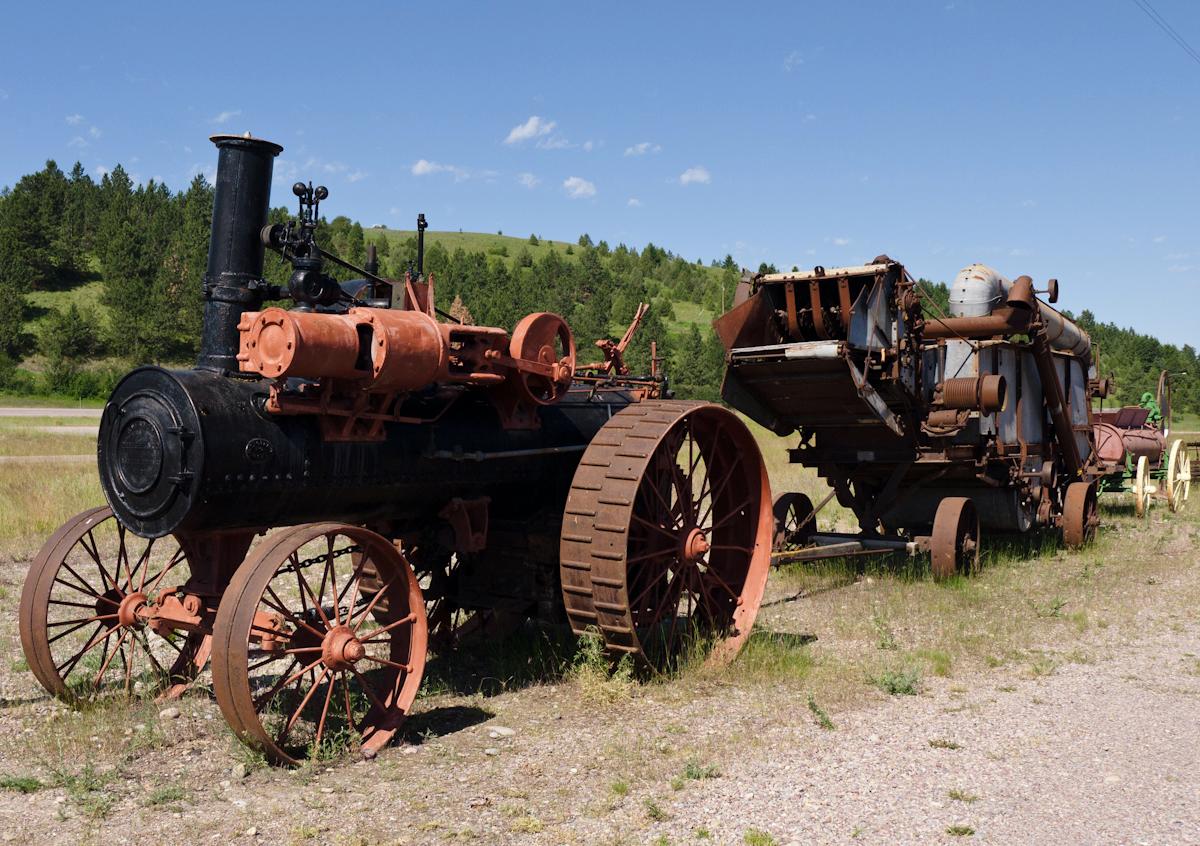 P1010561.jpg - Steam tractor and ancient farm implements.