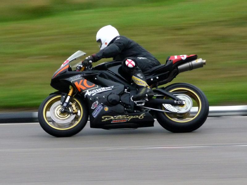 P1020043.JPG - Winner of the Newcomers Race seen at the famous Creg Na Baa corner.