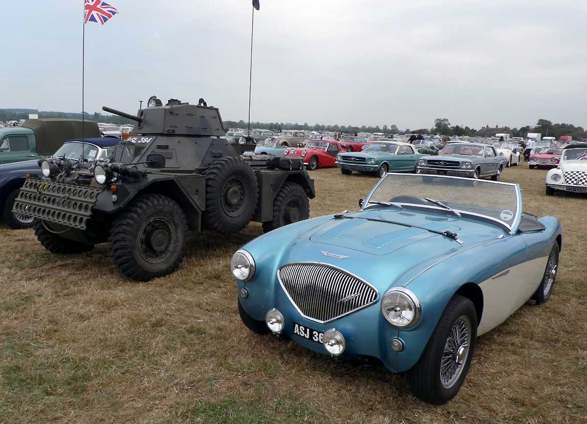 L1010935.JPG - The odd couple, a Healey 100M and an armored car. Note the road registration on the army vehicle.