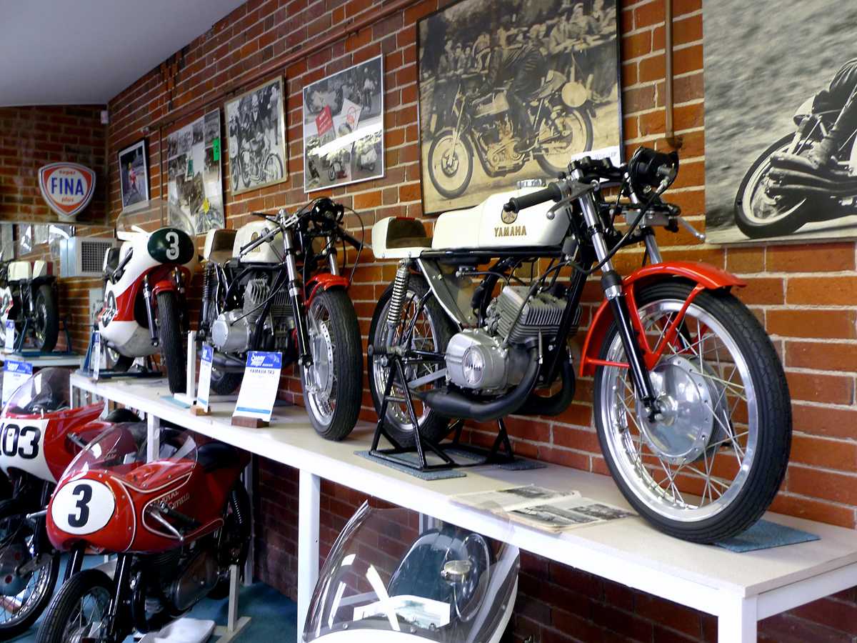 L1010550.JPG - A few later Yamaha two-stroke twins led by a 1972 TA125. The Miller Museum has the best collection of race bikes I've ever seen.