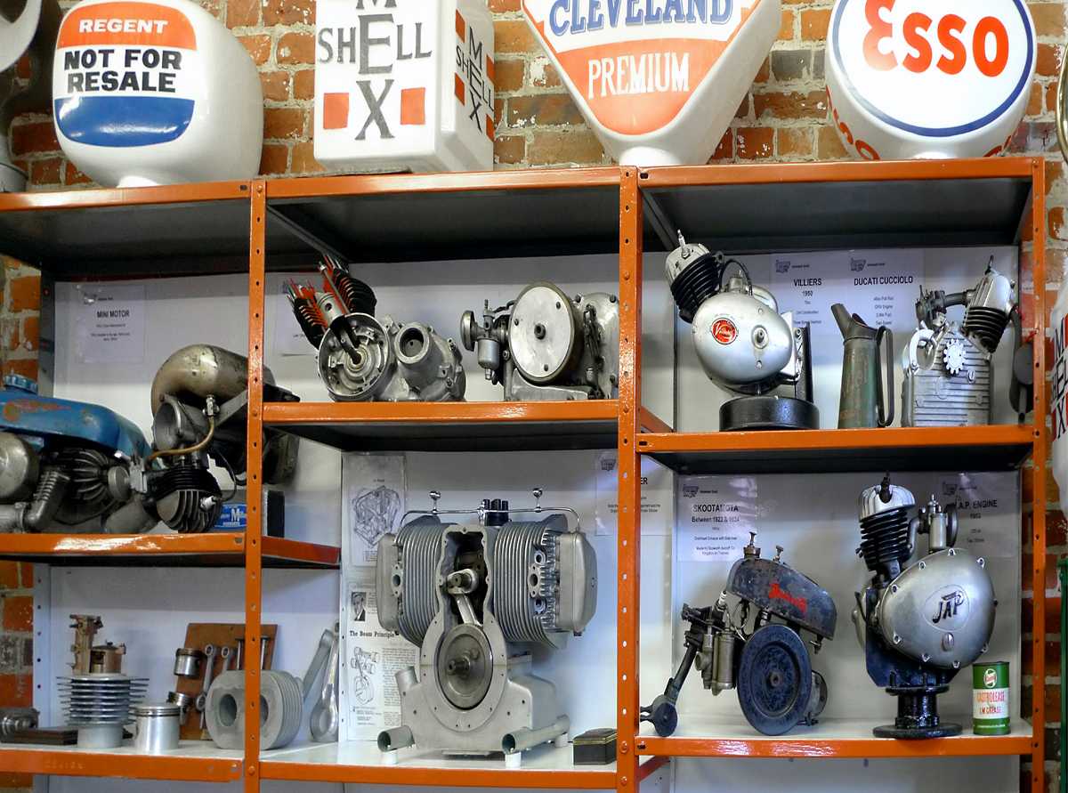 L1010570.JPG - The museum is chock-a-block with motorcycle memorabilia and ephemera. Here is a rack of cutaway motors as used in period for training and display.
