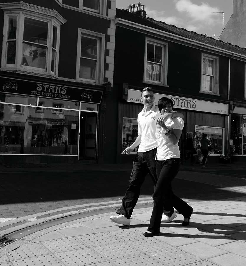 L1010383.JPG - A little "street photography", two young lovers clearly in step with each other.